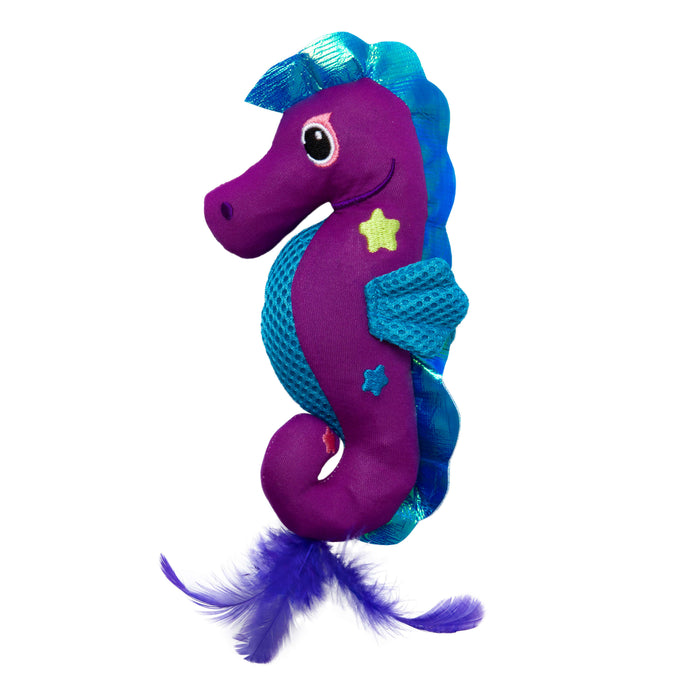 The Quirky Kitty Sea Horse Kicker is a bright purple ocean-themed catnip toy featuring blue fins, a blue mesh side, star patterns, big eyes, and playful purple feathers at the tail.
