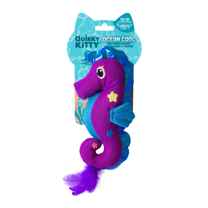 The Quirky Kitty Sea Horse Kicker is an ocean-themed catnip toy shaped like a purple seahorse with blue fins, yellow and pink stars, mesh accents, and a fluffy purple tail. It comes packaged on a blue card labeled Quirky Kitty Ocean Cool.