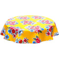 freckled sage round flowers on yellow oilcloth tablecloth