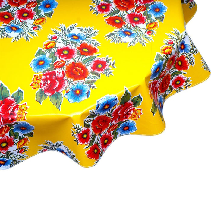 freckled sage round flowers on yellow oilcloth tablecloth