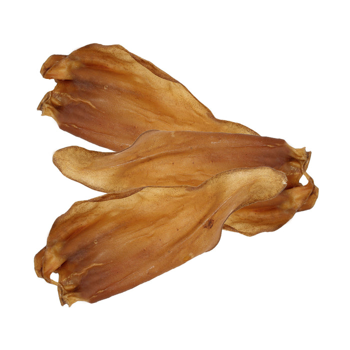 Three Wild Eats Natural Water Buffalo Ears are displayed on a white background. These 6 dog treats, known for promoting dental health, have a light brown, slightly curled appearance with a leathery texture enriched with natural protein.